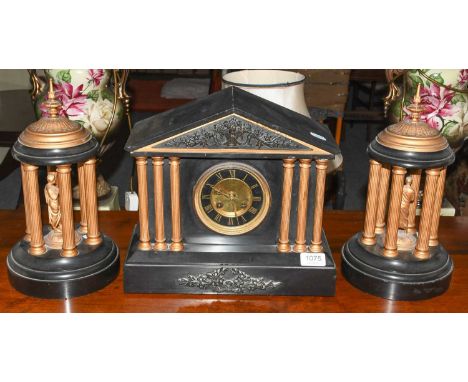 A Victorian black slate striking mantel clock and garniture circa 1880