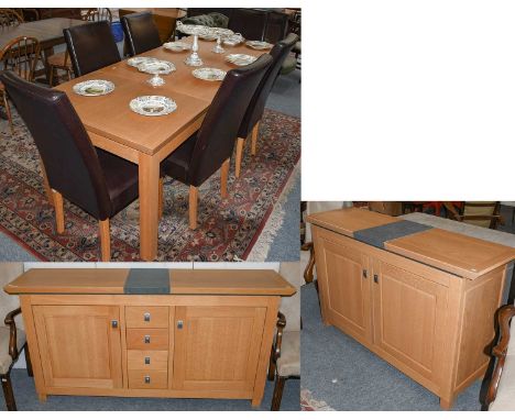 A modern light oak dining suite, comprising, two sideboards each inset with grey slate, largest, 187cm by 46cm by 93cm, small