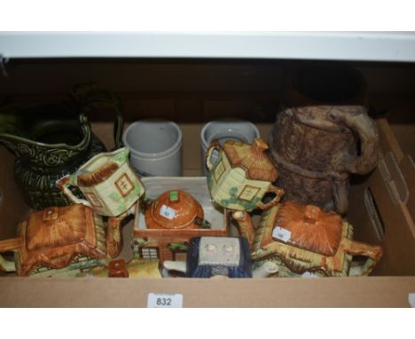 A group of novelty cottage ware teapots, an Arthur Wood green glaze jug, and three stoneware jars