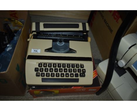 A 1970s Petite Super International typewriter with box