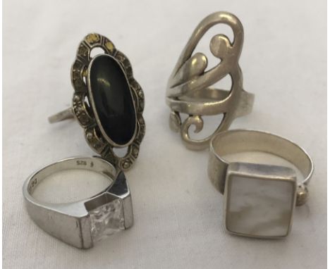 4 silver ladies dress rings to include stone set. Sizes range from K to P. 