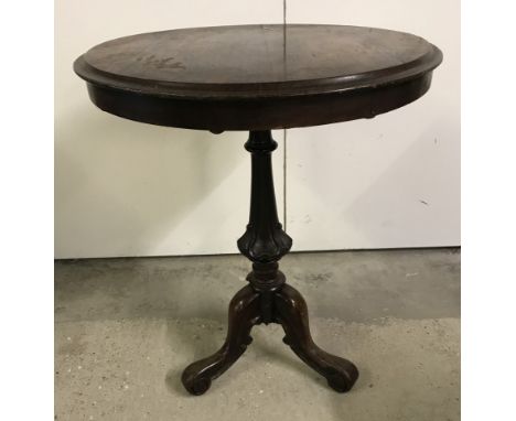 A small vintage tripod based occasional table with carved decoration to pedestal base. Top a/f. Table top approx. 57cm diamte