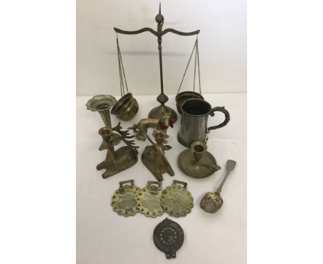 A small collection of brass and pewter items. To include deer candlesticks, tankard and scales. 