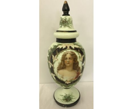 A Victorian hand painted opaline glass lidded vase. Portrait of a young lady in central panel surrounded by flora. Approx 51c