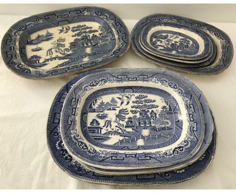 9 ceramic blue and white willow pattern meat platters / serving dishes of various sizes. To include H.A & Co. Some a/f. Large