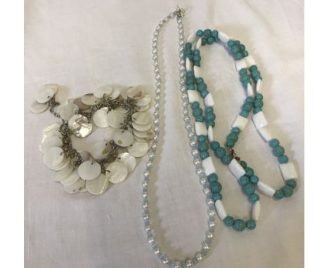 2 necklaces and a bracelet made from natural stones. Comprising of a long necklace of turquoise coloured beads a freshwater p