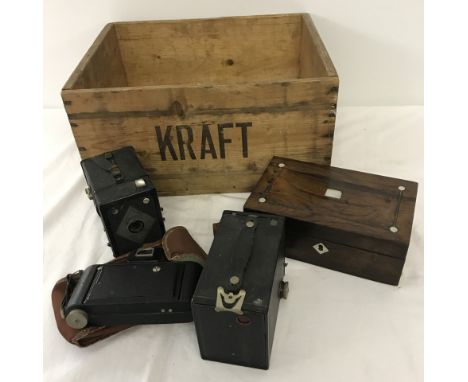 A vintage advertising box for Kraft. Together with a pearl inlaid small jewellery box and 3 vintage cameras. 