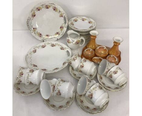 A Victorian ceramic tea set together with a German ceramic orange lustre dressing table set. Tea set comprises; 2 sandwich pl