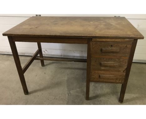 A vintage oak, single pedestal, 3 drawer desk.  Measures 97cm x 61cm x 70cm tall.