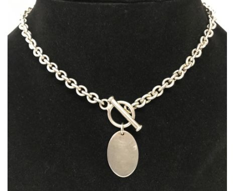 A hallmarked silver belcher style necklace with T bar fastening and blank oval pendant.  Chain lenth 15". Total weight approx