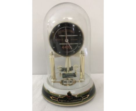 A Bradford Exchange "Legend of Locomotion Anniversary Clock" dome clock. With ceramic base and glass dome. Battery operated. 