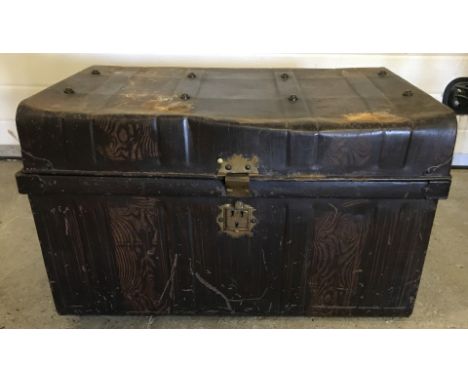 A vintage 2 handled tin trunk.  Approx. 69cm wide x 49cm tall.