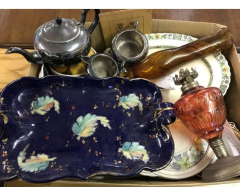 A box of assorted items to include ceramics, silver plated tea set, glass oil lamp and wooden items.  