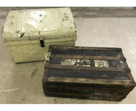 2 vintage trunks. A large cream painted tin trunk together with a wooden banded trunk. 