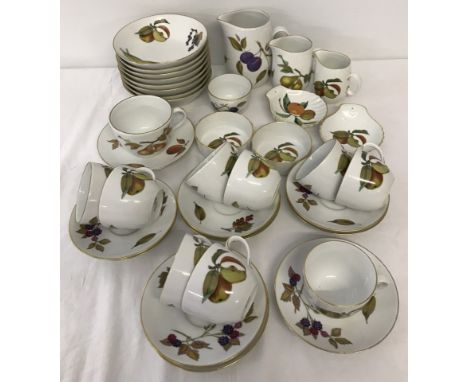 A quantity of Royal Worcester "Evesham" tea ware. Comprising; 9 cups and saucers, a set of 3 graduated jugs, 8 fruit bowls, a