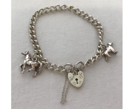 A modern silver charm bracelet with padlock and safety chain with 2 charms, a horse and a dog.  Total weight 18.9g.