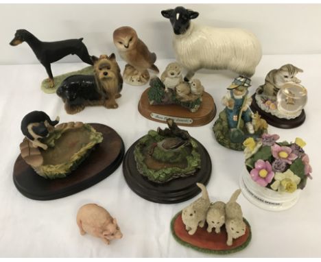 A box of assorted ceramic and resin figurines. To include, Border Fine Arts, Aynsley, Leonardo and Danbury Mint. 