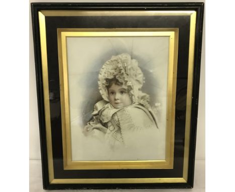 A framed and glazed Victorian photograph of a baby printed onto ceramic tile. Some damage to ceramic tile. Frame size approx.