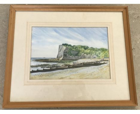 A framed and glazed watercolour of St.Margarets Bay, signed to lower right. By K Pitwa? Dated 1987. Approx. 23cm x 33.5cm.