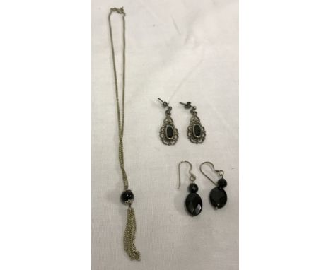 2 pairs of silver earrings together with a silver necklace, all set with black stones.  Necklace chain approx 14 inches