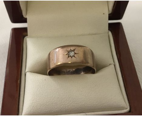Vintage 9ct rose gold band ring set with a small diamond with 'star' setting.  Weight approx 4g.