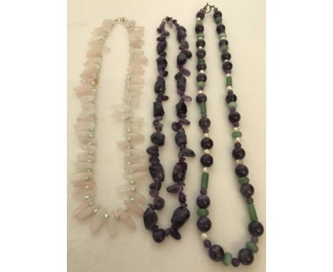 2 amethyst bead necklaces together with a rose quartz and pearl necklace.  