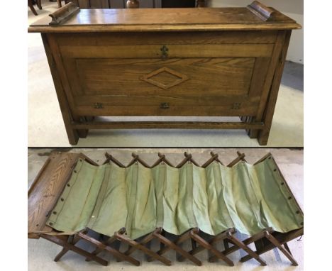 A vintage oak framed concertina style fold up bed.  Folded size approx. 86cm wide x 56cm tall.