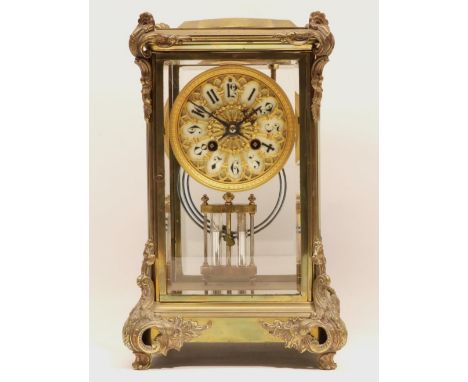 A &amp; N Paris - C19th brass four glass mantle clock, the case with applied rococo mounts, pierced brass dial with porcelain