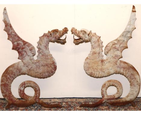 Pair of cast metal Dragon bench seat ends, with wing back supports and open mouth arm rests  on curled tail supports, W55cm H