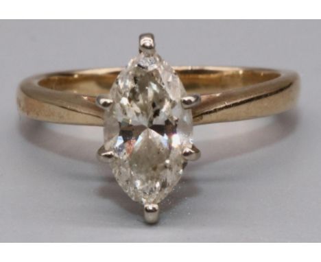 14ct yellow gold diamond solitaire ring set with single marquise cut diamond in claw setting, on tapered shoulders and plain 