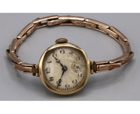 Swiss ladies gold wristwatch, silvered engine turned Arabic dial with subsidiary seconds, two piece case on gold on silver ex