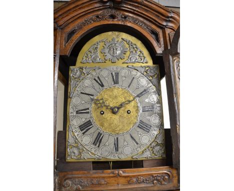 19th century French provincial oak longcase clock, 17in arched brass dial with silvered Roman chapter and sunburst arch, case