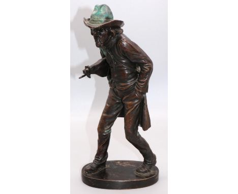 M. Faehnrich (C20th) "Wandering Violinist" patinated bronze model of a striding man in a hat and coat, carrying a bag and vio