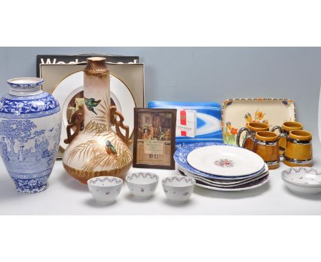 A large collection of various English ceramic ware to include Wade tankards, Wedgwood plate, Embassy cigarettes rubber mats, 