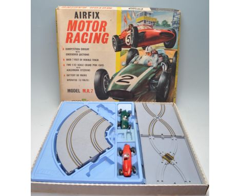 An original vintage Airfix Motor Racing Scalextric type slot car racing box set model MR.7 with track and cars. The set inclu