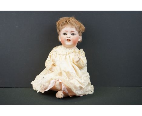 Simon &amp; Halbig bisque headed doll with brown glass flirty eyes, teeth, good face &amp; hair, some cracking to hands, fing