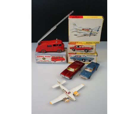 Four boxed Dinky diecast models to include 955 Fire Engine with Extending Ladder, 173 Pontiac Parisienne in metallic red, 174