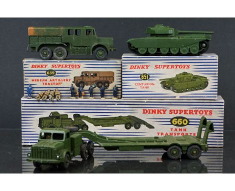 Three boxed Dinky Supertoys military diecast models to include 660 Tank Transporter, 689 Medium Artillery Tractor with diecas