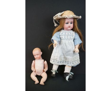 Two early 20th C dolls to include Simon &amp; Halbig bisque headed doll marked K R with star to back of neck, loose wig, slee