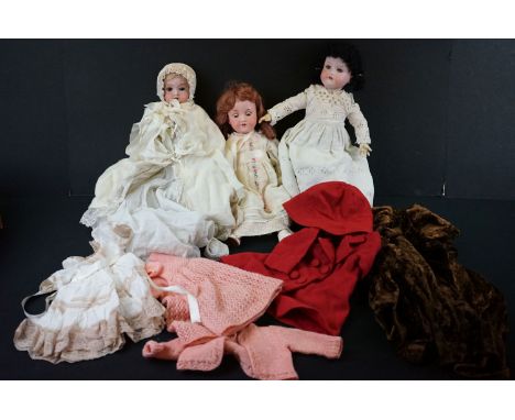 Three early 20th C Armand Marseille bisque headed dolls to include 1 x with sleeping brown glass eyes, with teeth, damage to 