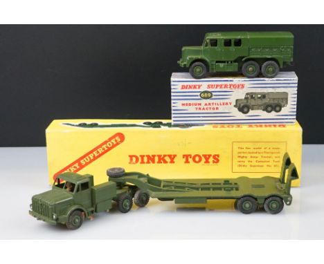 Two boxed Dinky Supertoys military diecast models to include 660 Tank Transporter and 689 Medium Artillery Tractor, some pain