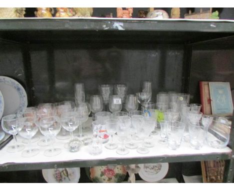 A shelf of drinking glasses