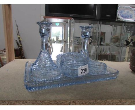 A blue glass trinket set