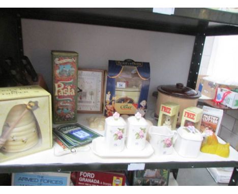 A shelf of miscellaneous including Beauty and the Beast butter dish, boxed honey pot etc