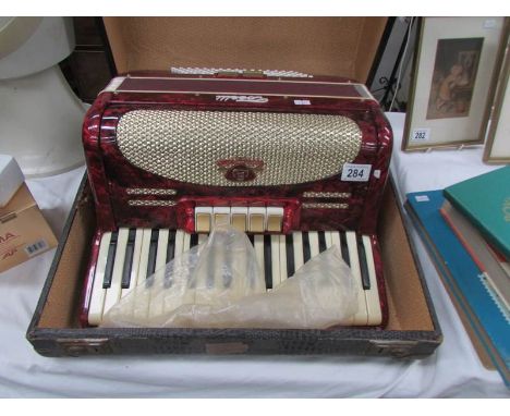 A cased piano accordion