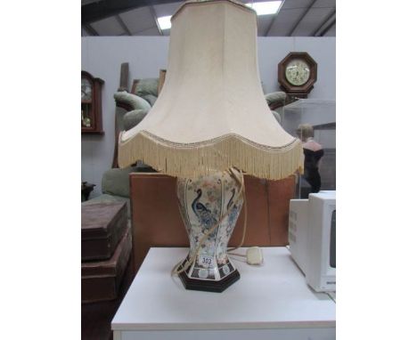 An oriental style table lamp with shade