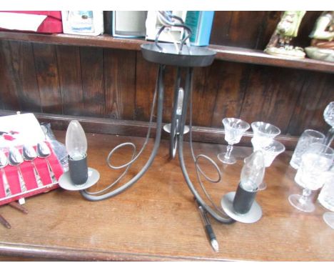 A metal 3 lamp ceiling light
