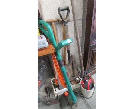A quantity of garden tools including strimmer