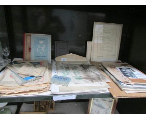 A shelf of ephemera including ration books