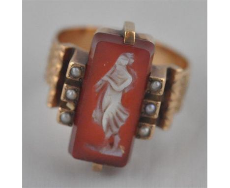 A yellow metal and banded agate cameo scarf clasp and ring set,&nbsp;the brooch having banded agate carved with cameo of Grec